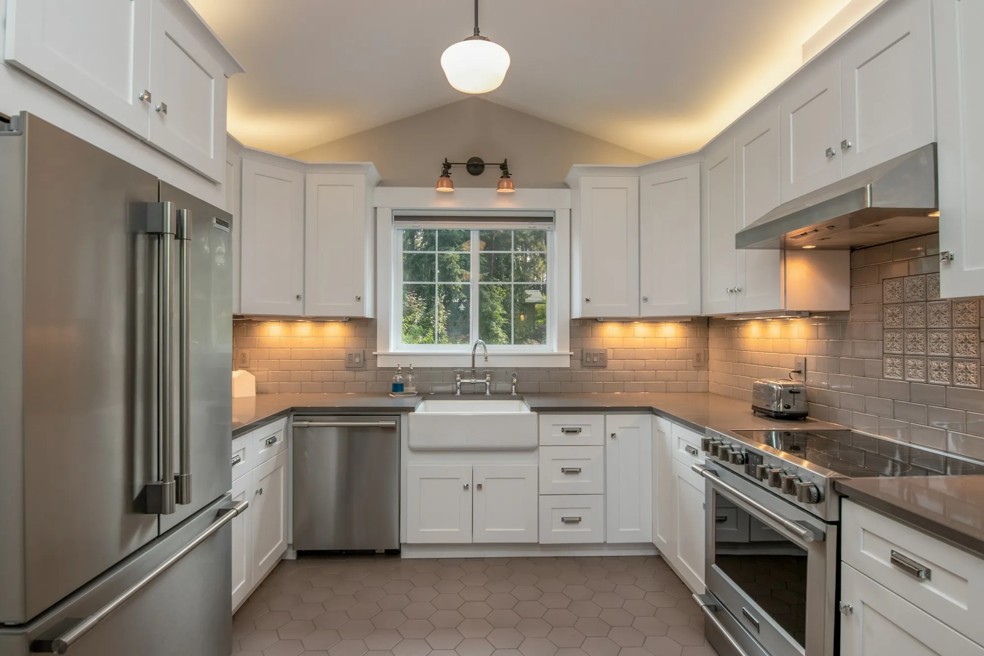 Updated kitchen with fresh cabinetry and lighting